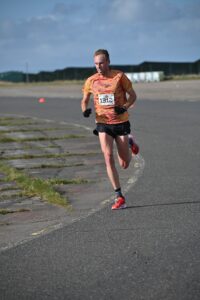 Ben Connor setting RunThrough record Half Marathon at Prestwold Hall 2023